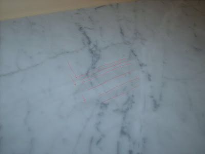 what are these grey streaks on my carrera marble?(pics) - Ceramic Tile