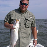 Zac (aka Gatorbait) with a fat trout from East Bay caught on a glow Devil Eye
