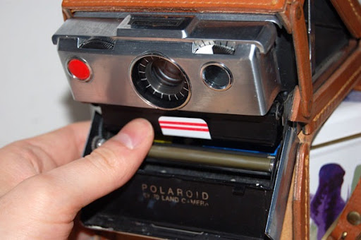 Polaroid SX-70 Macchina Fotografica Istantanea + Custodia in cuoio ori –  sviluppo rullino