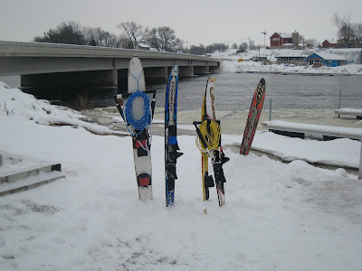 The drop skis... in the snow.