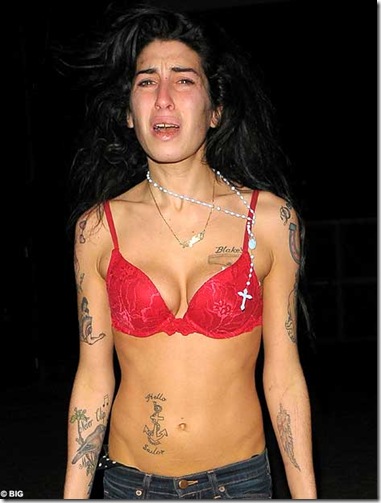 Distressed Amy Winehouse wanders the streets barefoot