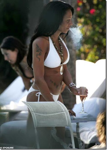 Melanie Brown in White Bikini enjoys cigarette and champagne in Miami picture