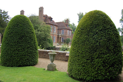 Groombride house framed by clipped yews