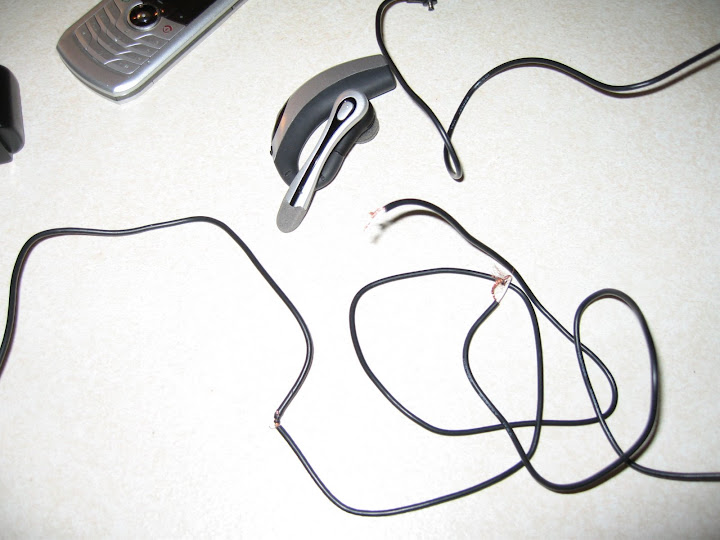 frayed headset charger wire. stoopid cat