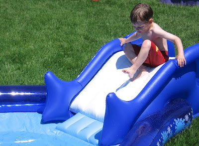BigE sliding down the new inflatable pool