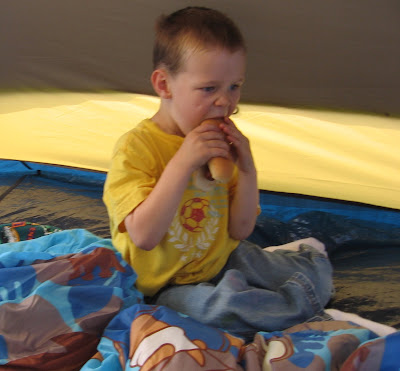 BigE having a hotdog in the tent