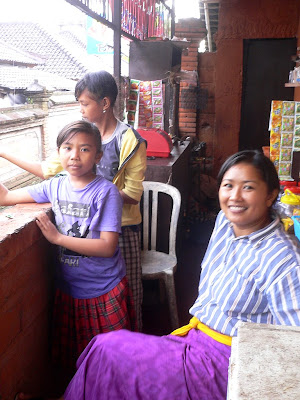 Proprietress, daughter and friend, drink stall