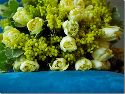 Check out this arrangement of yellow tulips and mimosa by Jane Packer (found 