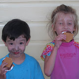 Kai (with charcoal on his face) and Alex enjoying s'mores