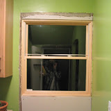 Interior view of the pantry window. I told the contractor Iâ€™d take care of the interior patching, since Iâ€™m comfortable doing that work. So far Iâ€™ve just cut and mounted the drywall. (Weâ€™ve temporarily removed the cabinets from under the window.)
