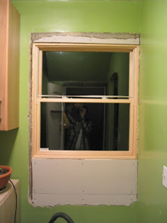 Interior view of the pantry window. I told the contractor Iâ€™d take care of the interior patching, since Iâ€™m comfortable doing that work. So far Iâ€™ve just cut and mounted the drywall. (Weâ€™ve temporarily removed the cabinets from under the window.)