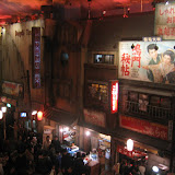The lower level of the Ramen Museum. The white and red sign for the bakery shop reads â€œhoomuran beekariiâ€ (homerun bakery).