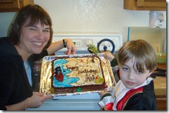Eva and Kal showing off his cool pirate cake!  Awesome!