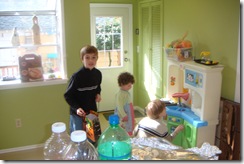 Quinn, Kal and friend playing kitchen in the kitchen