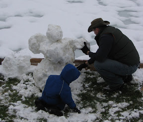 BigE and Dadda working on the snowman