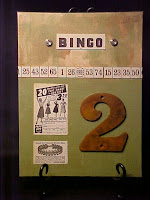 This in on a 9"X12" canvas board backed with pages from an old encyclopedia.  This piece has been stained with walnut ink and painted with acrylics.  I've included a great rusted "2", metal buttons and paper ephemera.  It is OOAK and signed.  It has been 