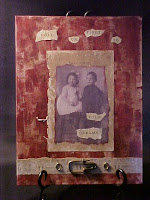 This piece is on 9"X12" canvas board backed with old encyclopedia pages.  It is painted with ink and acrylics and has a picture of two super cute kids.  I have no idea who they are.  I used alittle hardware with this one as well.  No symbolism involved, I