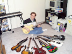My guitar collection as of April 1999... No, I’m not really smoking a joint... L to R: Steinberger GM7-T, Paul Reed Smith EG, Parker Fly Classic, Ibanez JPM100-P1, Ibanez JS1000-WH, Ibanez UV777-BK Universe + Gibson Les Paul Kalamazoo