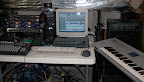 Former basement studio setup... Rack top to bottom: (2) ART Tube Channel preamps, (2) ART TPS preamps, Behringer Multicom compressor + Carvin SM-162 mixer + Custom-built P4 system + Cakewalk/Peavey StudioMix console + Creative ProdiKeys keyboard + Korg Triton workstation