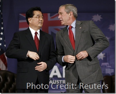 Hu and Bush button up their jackets at the end of their bilateral meeting in Sydney