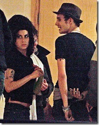 Amy Winehouse kissed her husband Blake Fielder-Civil as he was led away in handcuffs last week1