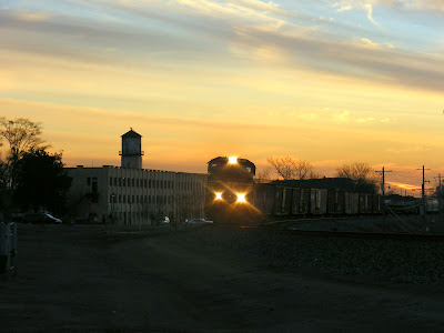 Train in front of Bona Allen Tannery at Sunset